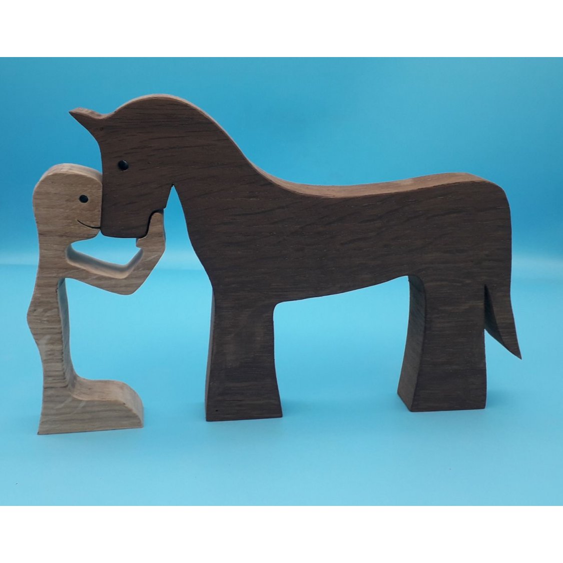 Figurine Man and his horse in wood