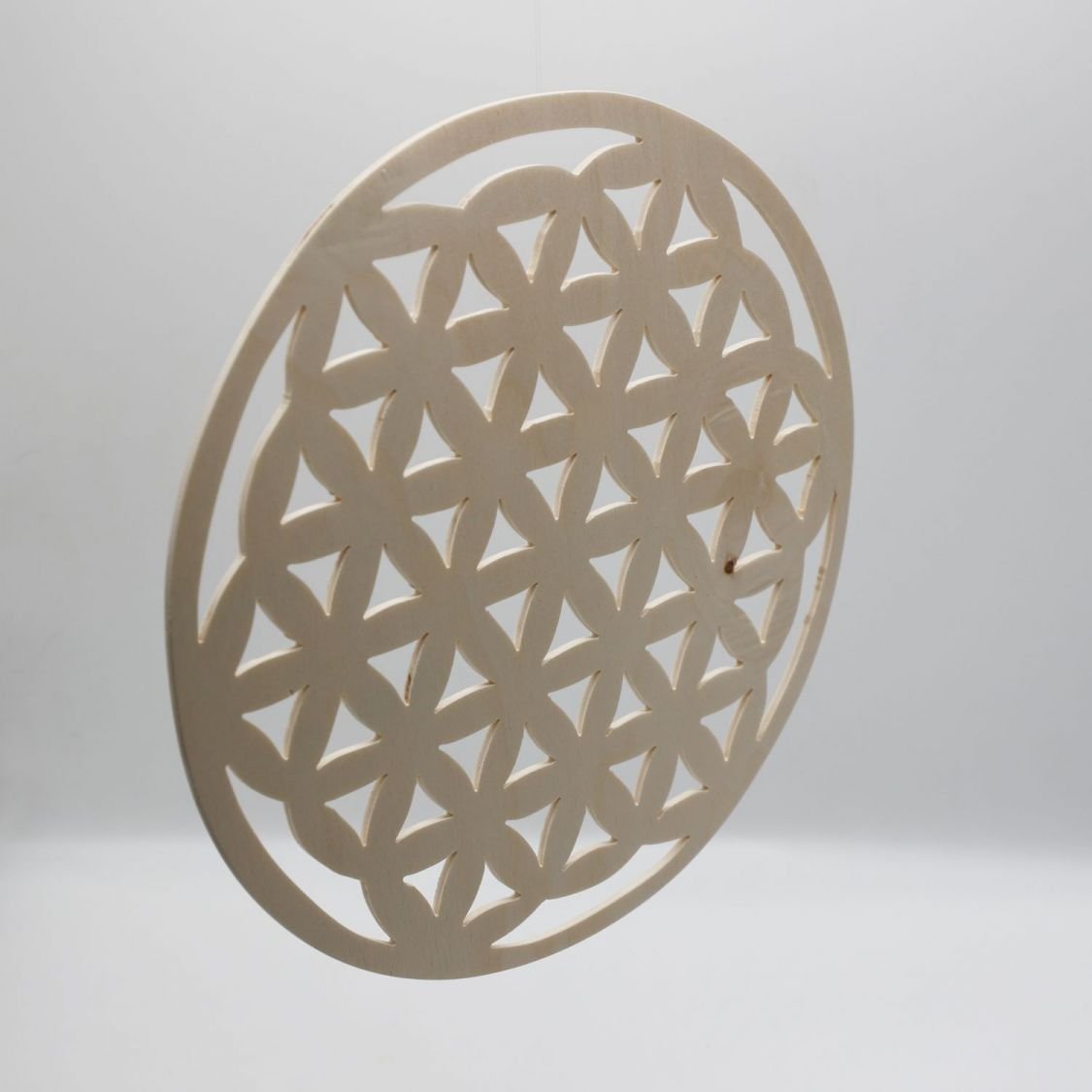 Flower of life in cut wood