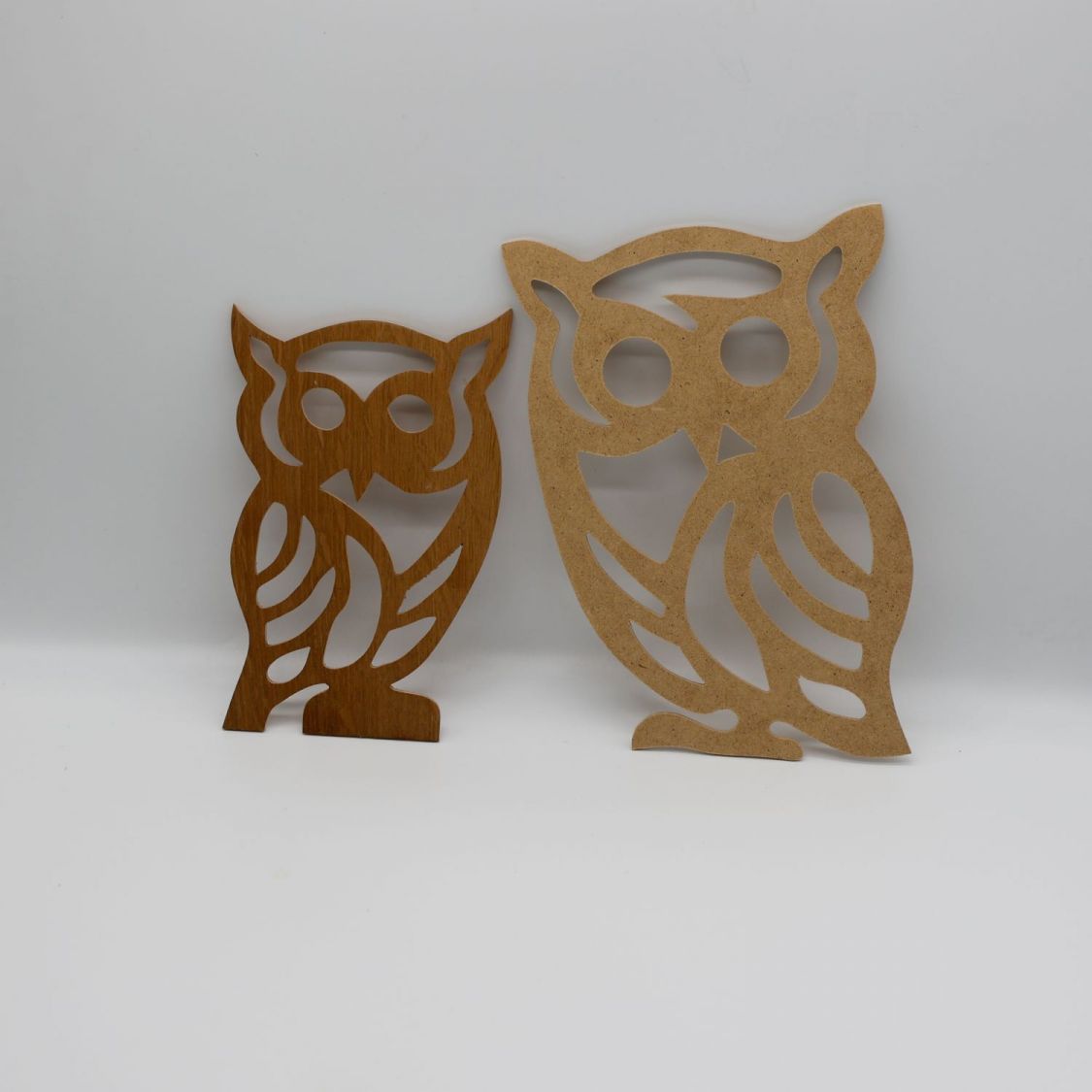 Silhouette of Owl cut out of wood panel