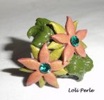 Brown clay flower ring with Swarovski crystal and green foliage