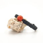 Woven rope bracelet with orange gorgon bead