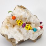 Multicolored stone bracelet with yellow skull