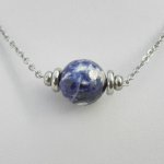 Solitaire necklace with round blue sodalite stone and stainless steel beads