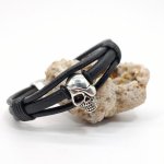 Skull and crossbones bracelet on black leather cords