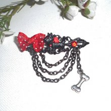 Black and red resin dog brooch with small bow and black chain