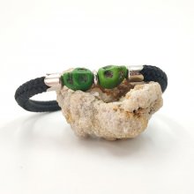 Double skull and crossbones bracelet with green stones on black rope