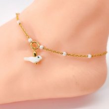 Anklet with mother-of-pearl beads and bird on gold plated stainless steel chain