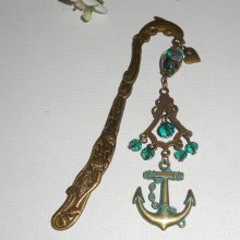 Bronze metal dolphin page marker with green crystal beads and ink