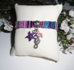 Colorful fabric bracelet with seahorse and purple starfish tassels