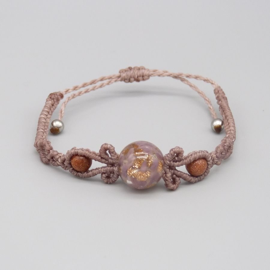 Micro macramé bracelet in taupe color with a glass bead