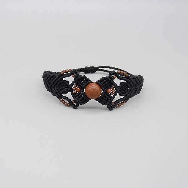 Black micro-macram&eacute; bracelet with a central "sun stone" bead