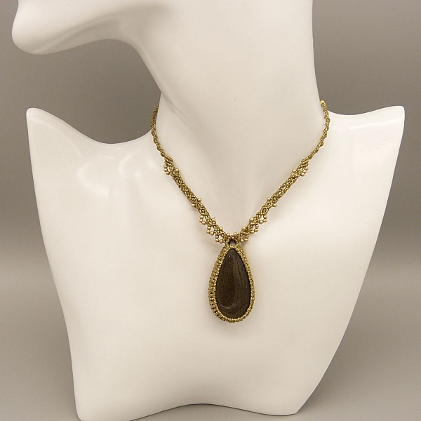 Golden micro-macram&eacute; necklace with a golden obsidian 