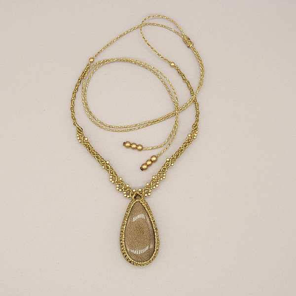 Golden micro-macram&eacute; necklace with a golden obsidian 