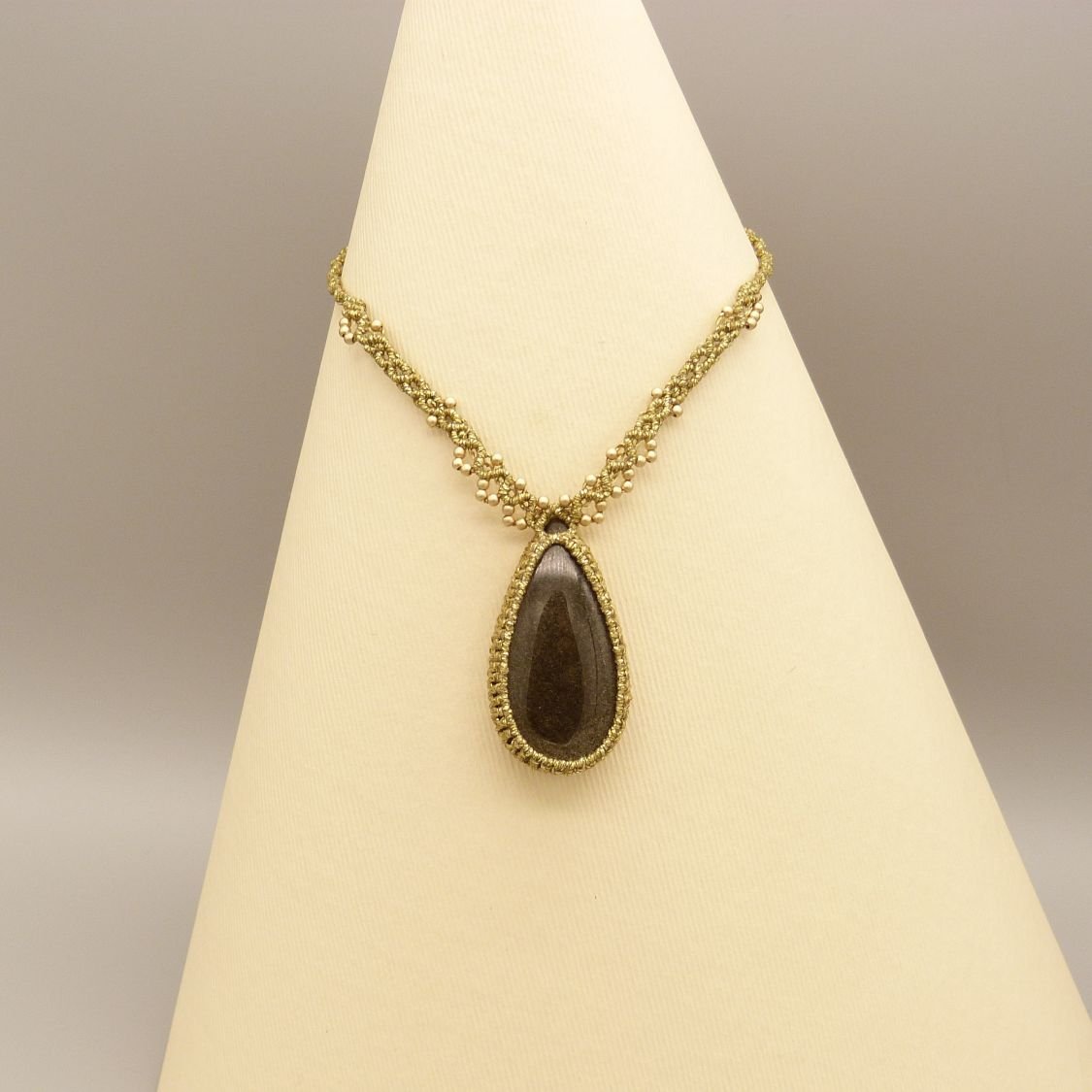 Golden micro-macramé necklace with a golden obsidian 