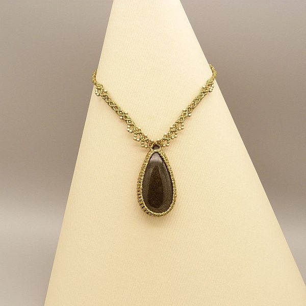 Golden micro-macram&eacute; necklace with a golden obsidian 