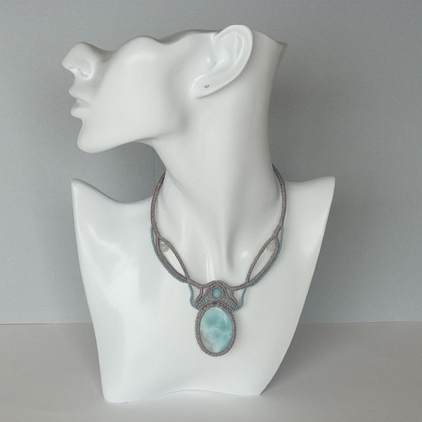 Necklace in taupe gray/frosted blue micro-macram&eacute; with a natural gemstone in soft shades of white and light blue in the center.