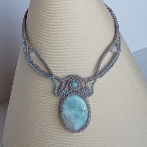 Necklace in taupe gray/frosted blue micro-macram&eacute; with a natural gemstone in soft shades of white and light blue in the center.