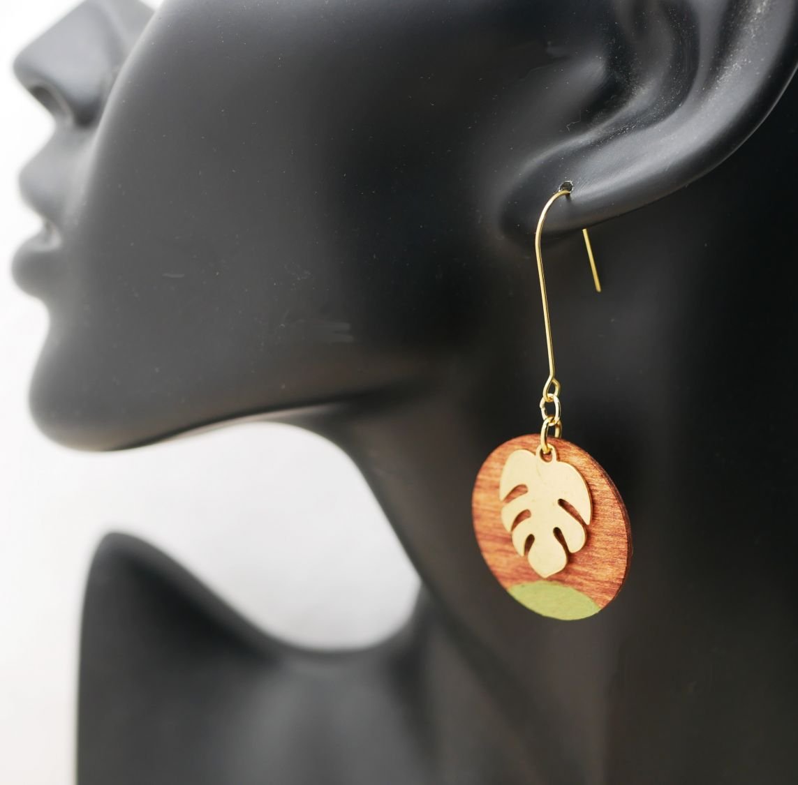 Cherry wood and monstera leaf earrings in gold plated brass