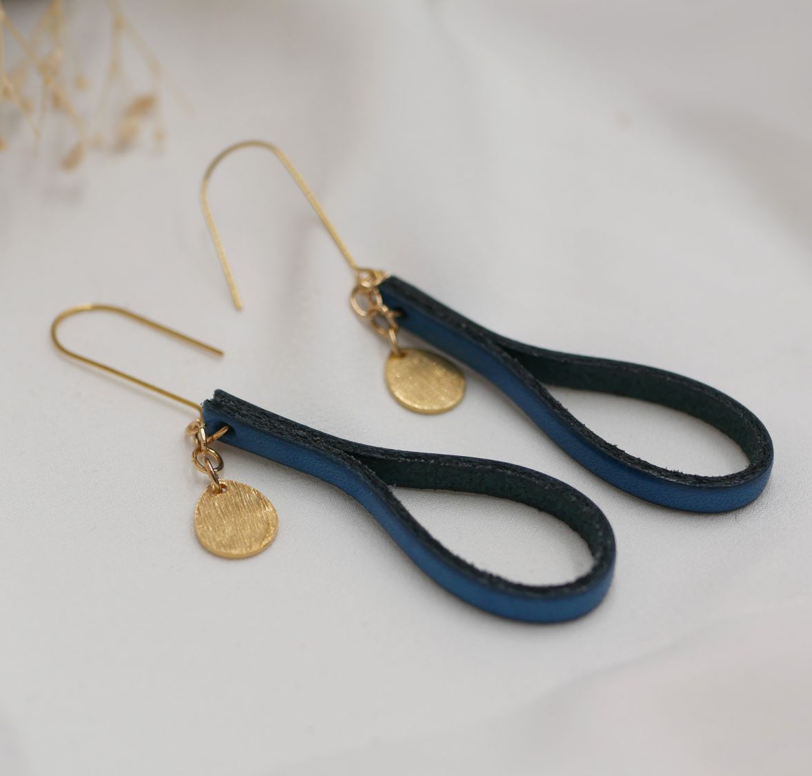 Blue leather earrings with gold tassel