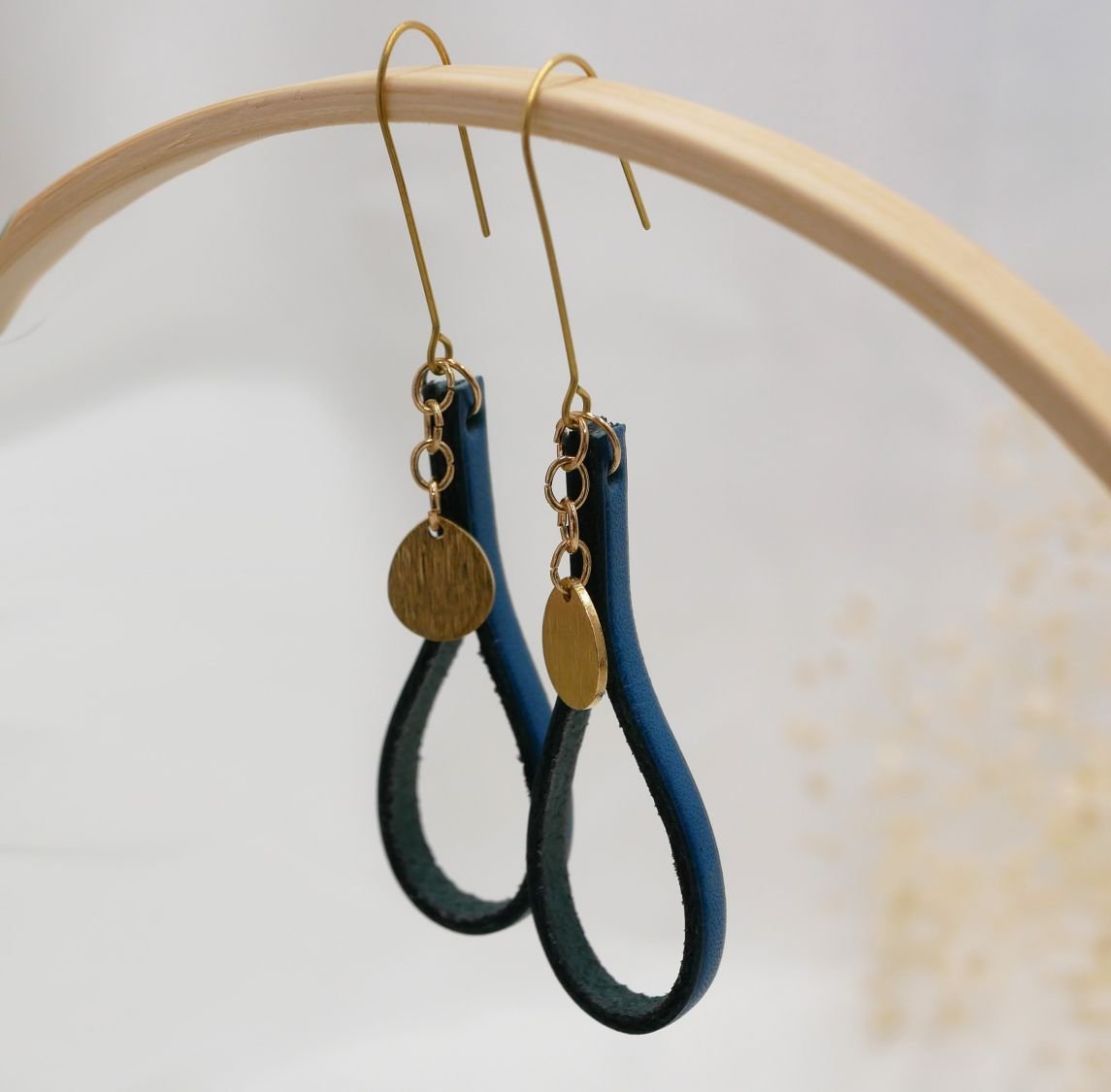 Blue leather earrings with gold tassel