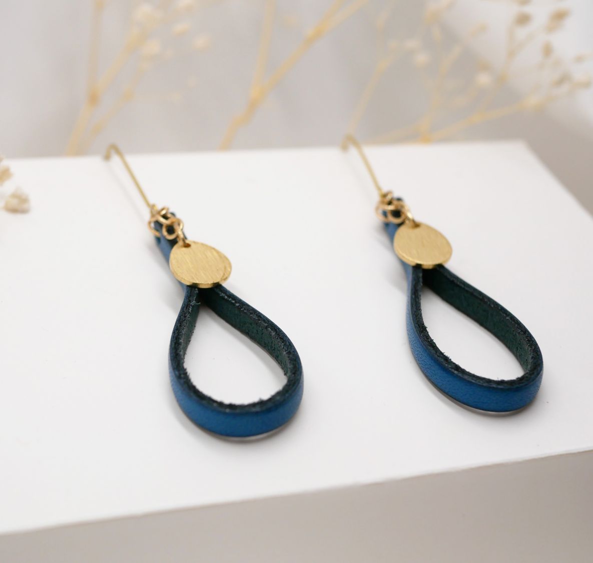 Blue leather earrings with gold tassel