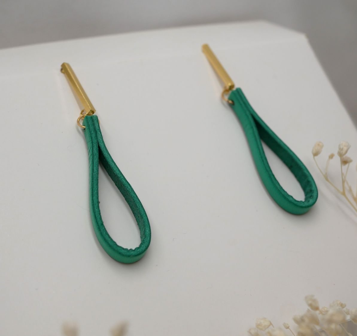 Jade leather earrings with long golden rectangular studs