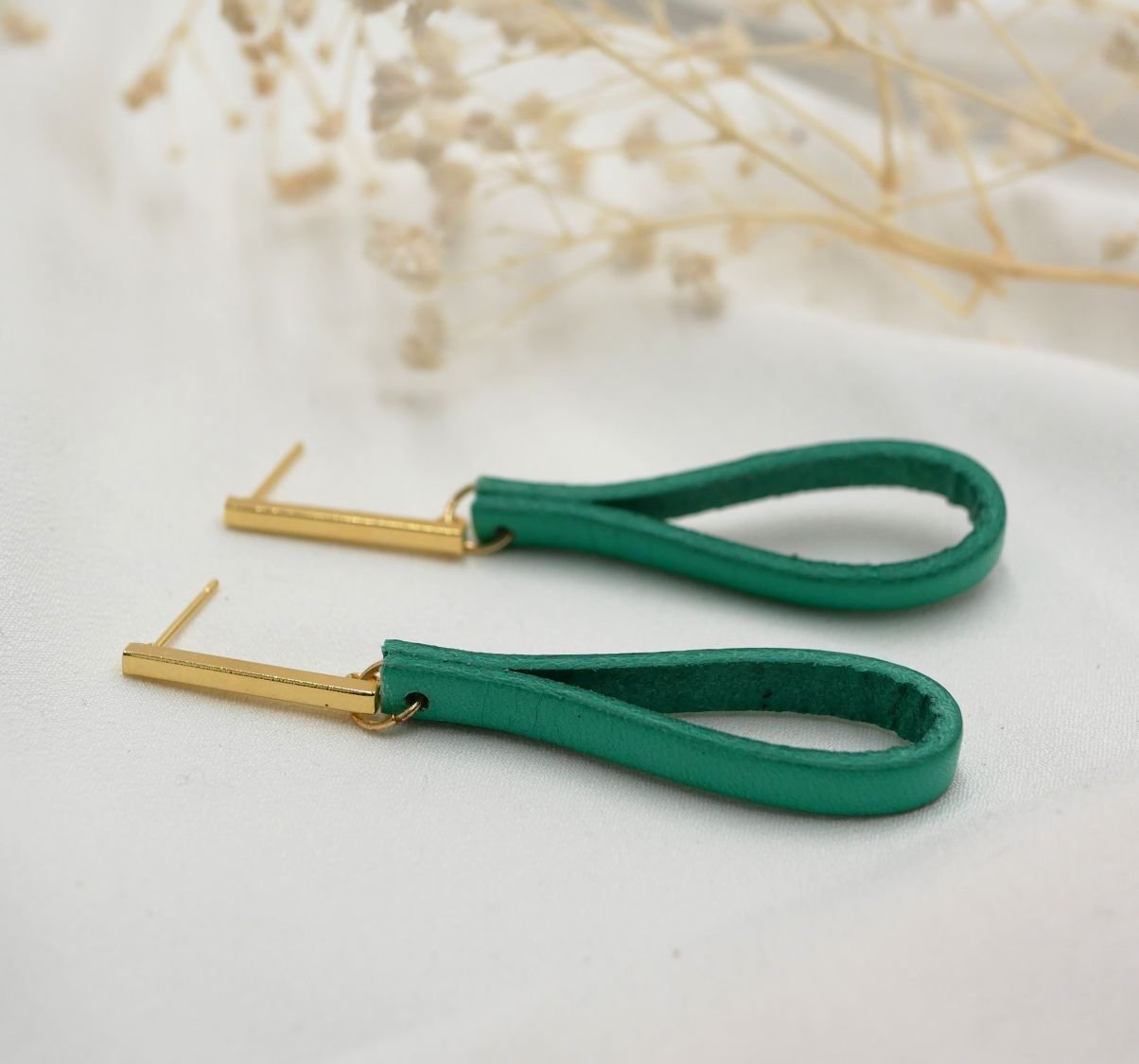 Jade leather earrings with long golden rectangular studs