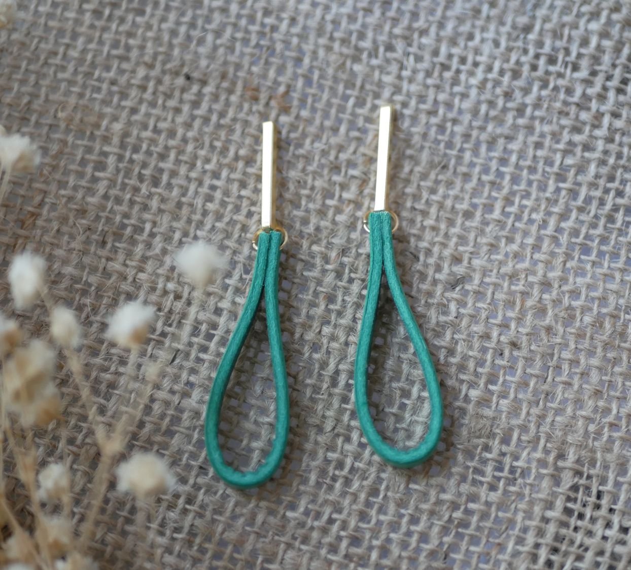 Jade leather earrings with long golden rectangular studs