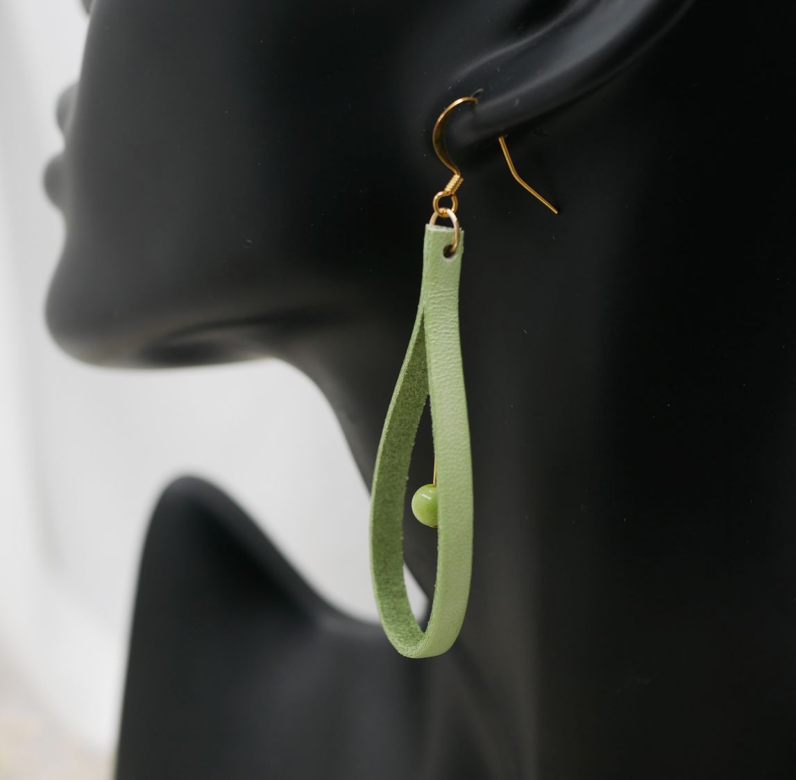 Almond green leather and light green gemstone earrings