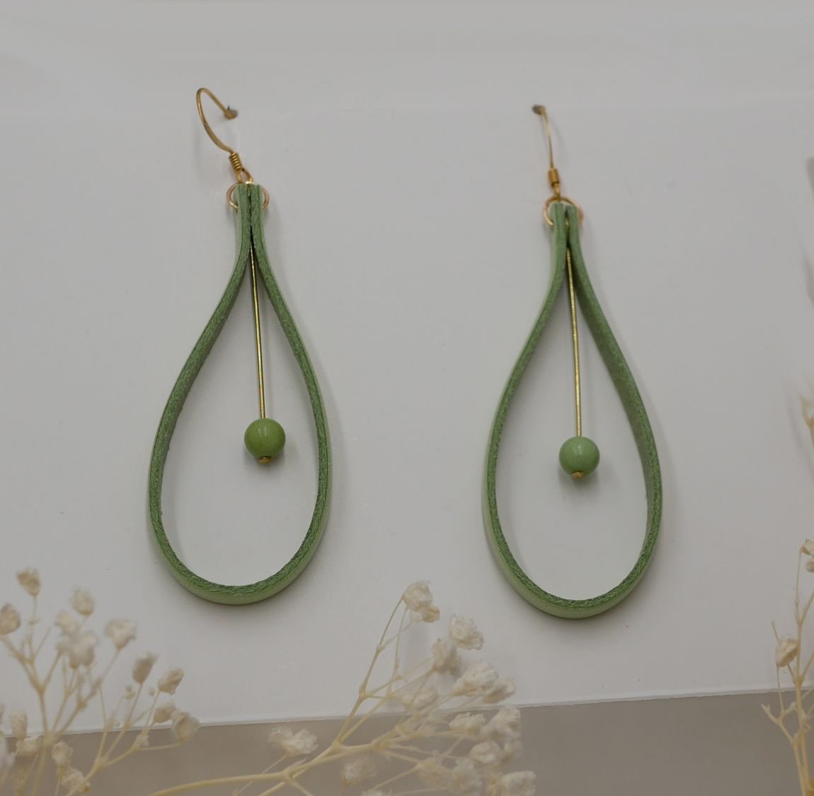 Almond green leather and light green gemstone earrings