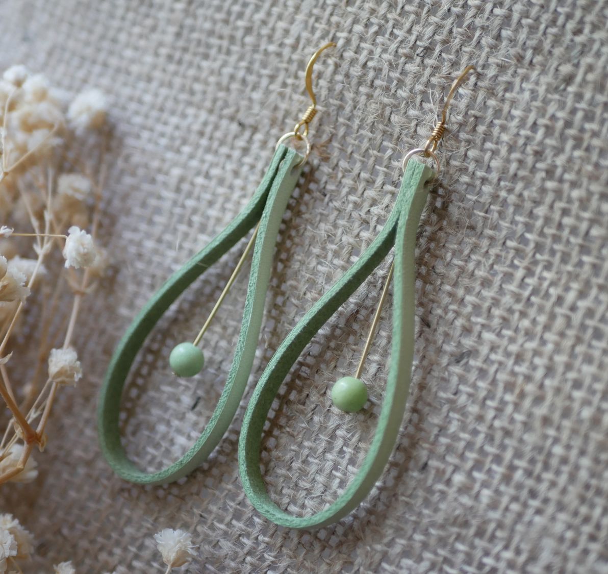 Almond green leather and light green gemstone earrings