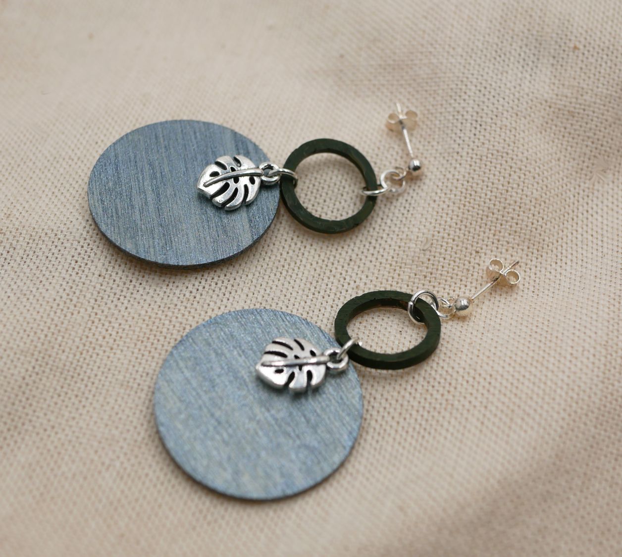 Grey and green wood monstera leaves graphic earrings