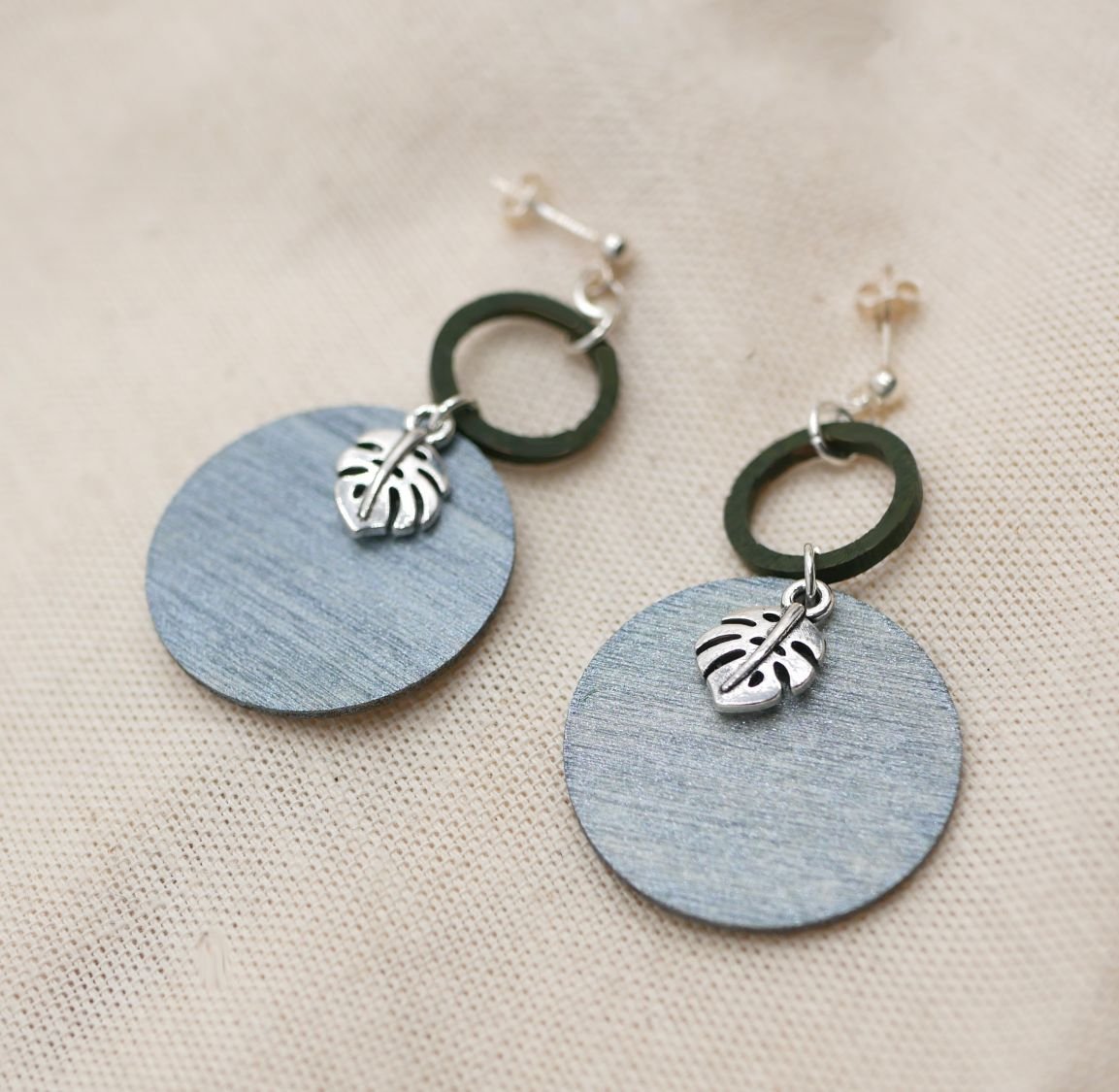 Grey and green wood monstera leaves graphic earrings