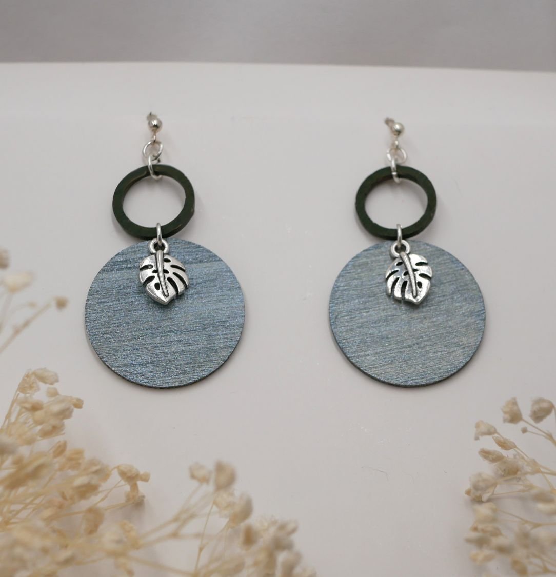 Grey and green wood monstera leaves graphic earrings