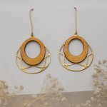 Gold plated oval wooden earrings on openwork brass tassel