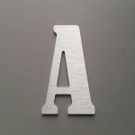 Brushed metal letter BERNARD CONDENSED