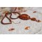Lady in Orange pendant necklace is embroidered with Swarovski crystals, Miyuki seed beads and magic beads.
