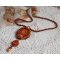 Lady in Orange pendant necklace is embroidered with Swarovski crystals, Miyuki seed beads and magic beads.