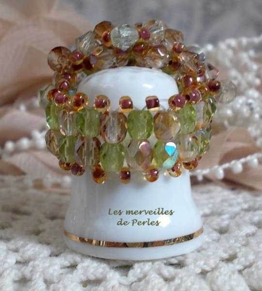 Veronese ring with facets, spinning tops and a Swarovski crystal shuttle