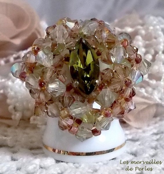 Veronese ring with facets, spinning tops and a Swarovski crystal shuttle