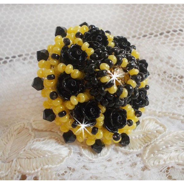 Dorine ring embroidered with black rose cabochons, a Crystal bezel and Jet and Yellow seed beads