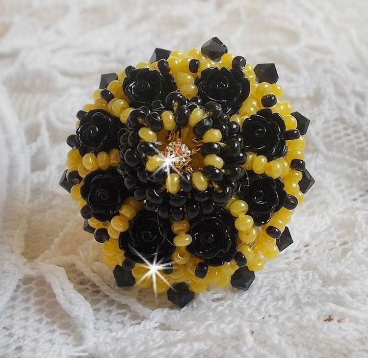 Dorine ring embroidered with black rose cabochons, a Crystal bezel and Jet and Yellow seed beads