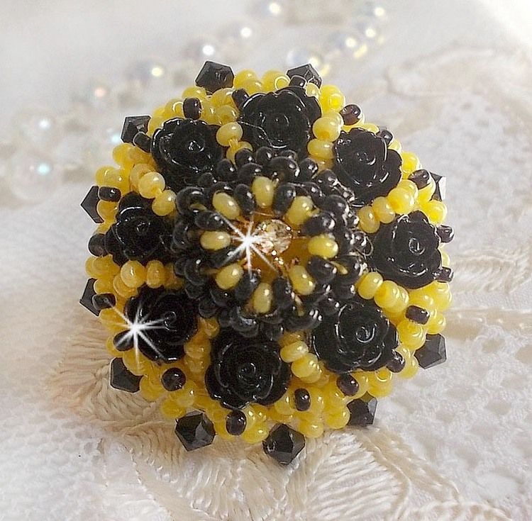 Dorine ring embroidered with black rose cabochons, a Crystal bezel and Jet and Yellow seed beads