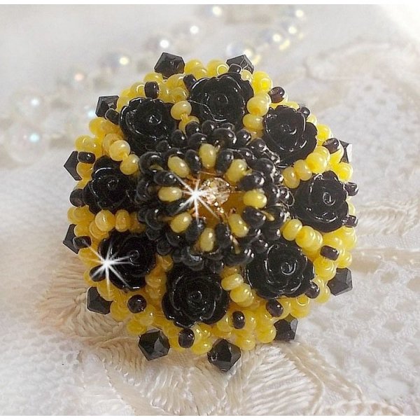 Dorine ring embroidered with black rose cabochons, a Crystal bezel and Jet and Yellow seed beads