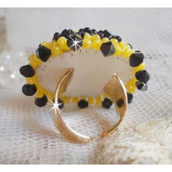 Dorine ring embroidered with black rose cabochons, a Crystal bezel and Jet and Yellow seed beads