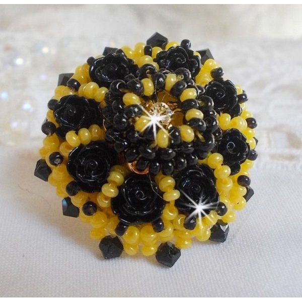 Dorine ring embroidered with black rose cabochons, a Crystal bezel and Jet and Yellow seed beads