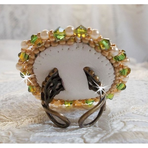 Garden Party ring embroidered with a 1960's bohemian crystal cabochon, Swarovski crystals, pearl beads and seed beads 