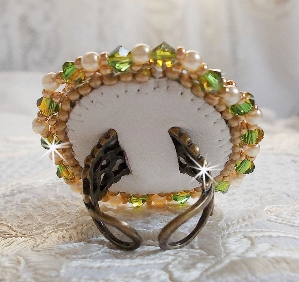 Garden Party ring embroidered with a 1960's bohemian crystal cabochon, Swarovski crystals, pearl beads and seed beads 