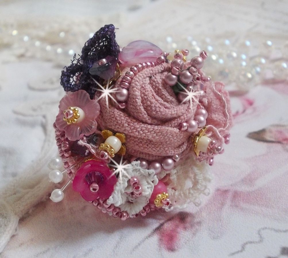 Poetic Garden ring embroidered with linen, fine lace, Swarovski crystals, Mother of Pearl leaf, Lucite flowers, glass beads and seed beads 