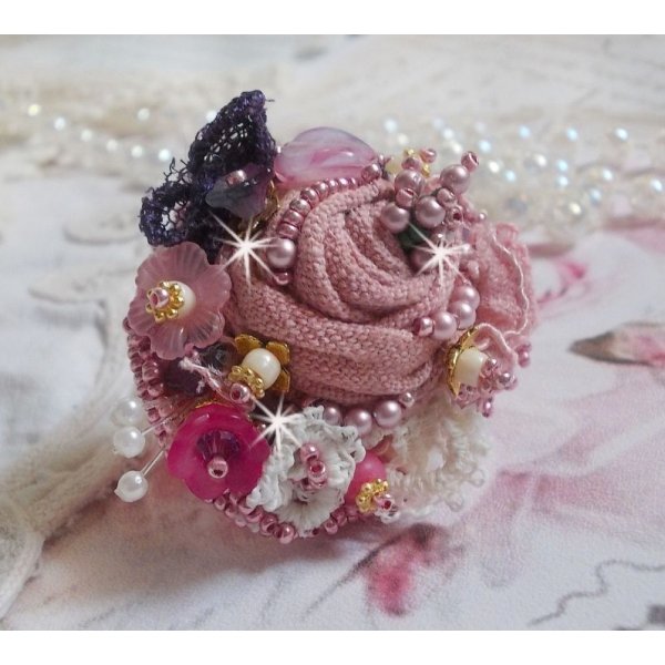 Poetic Garden ring embroidered with linen, fine lace, Swarovski crystals, Mother of Pearl leaf, Lucite flowers, glass beads and seed beads 